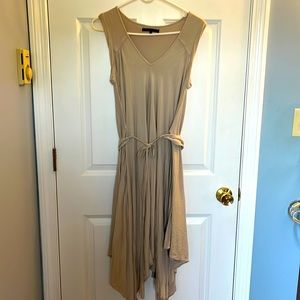 This is a BCBG Maxazria light beige sleeveless dress